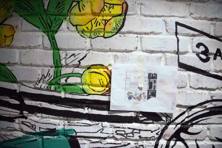 Detail of hand painted illustration applied directly onto brick wall inside Kiehl’s Regent Street store