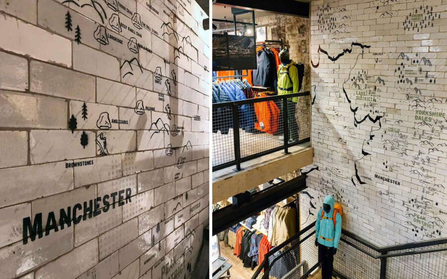 Interior stairwell wall graphics showing painted map artwork on reclaimed tiles at Patagonia Manchester
