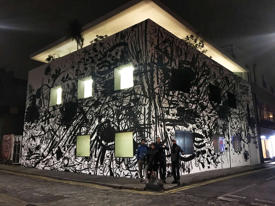 Feinschmecker mural on the Dirty House studio building at night in Shoreditch London