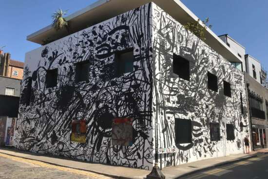 Feinschmecker mural by Sue Webster painted on the Dirty House building in Shoreditch London