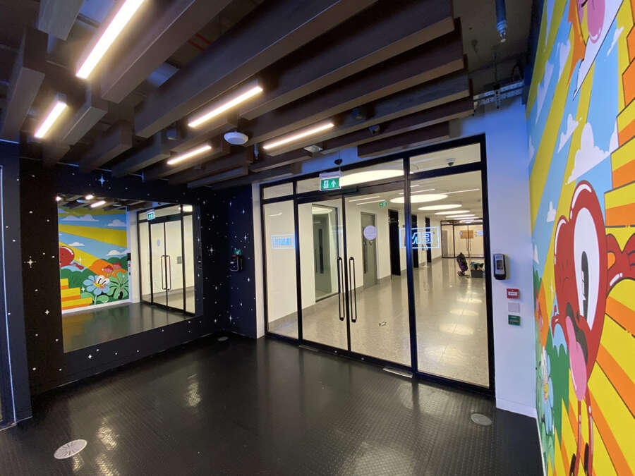 Interior entrance corridor with Hattie Stewart mural at EMI London headquarters