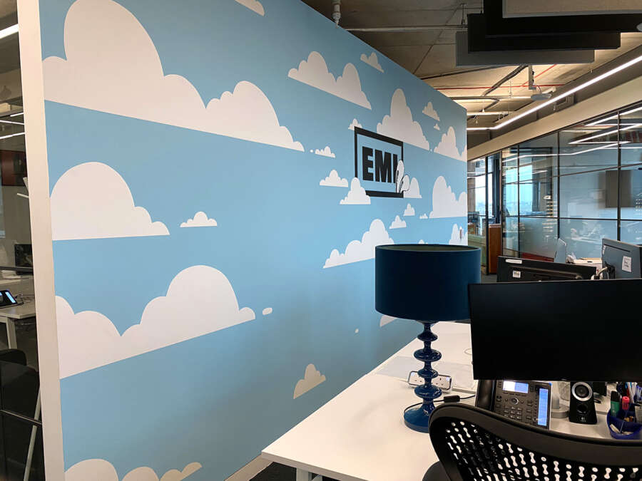Blue sky and cloud mural installed inside EMI London office workspace