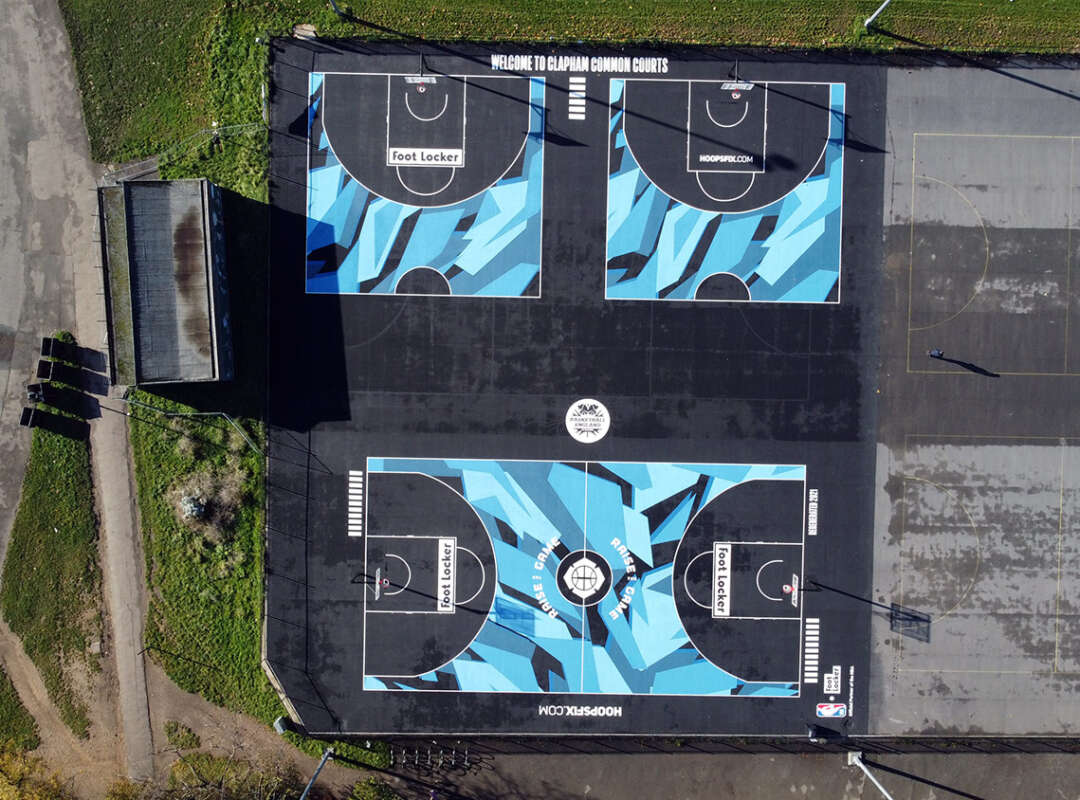 Drone view of painted basketball courts at Clapham Common including one full court and two half courts