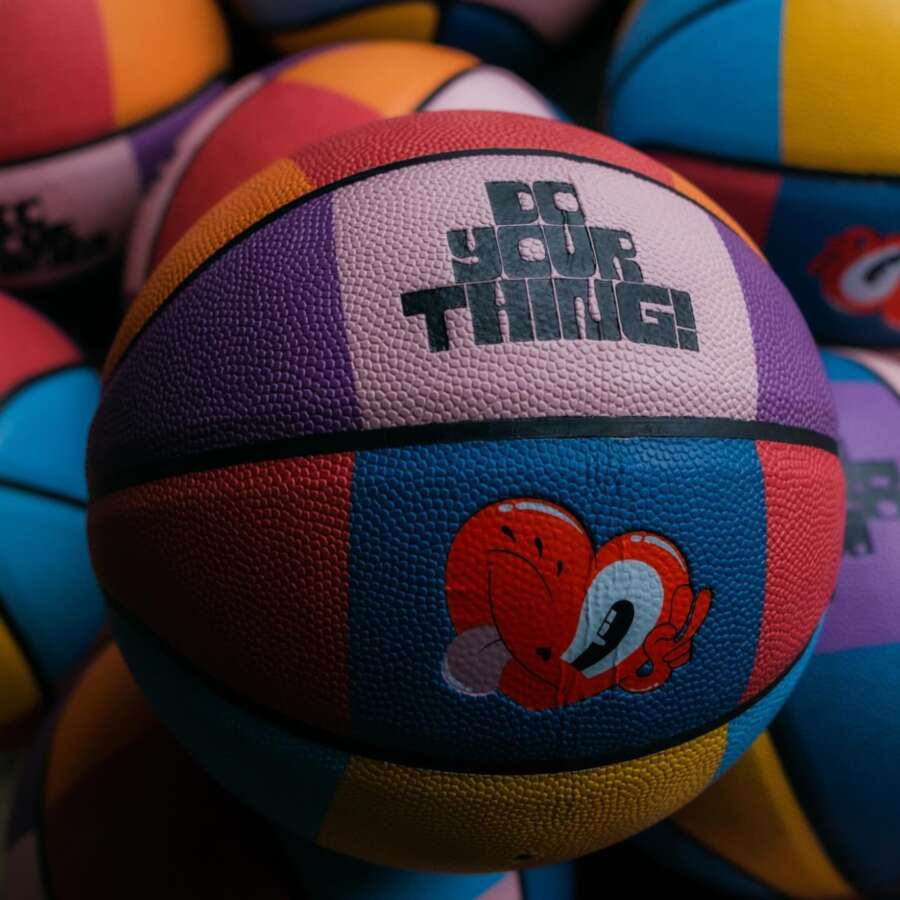 Custom basketball featuring artwork from the Orchard Park painted basketball court mural