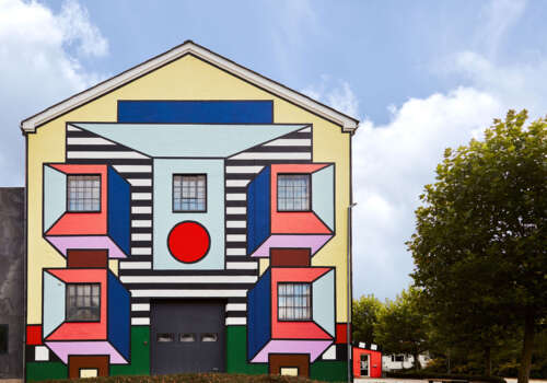 Camille Walala building wrap on Montana Furniture factory façade in Haarby Denmark