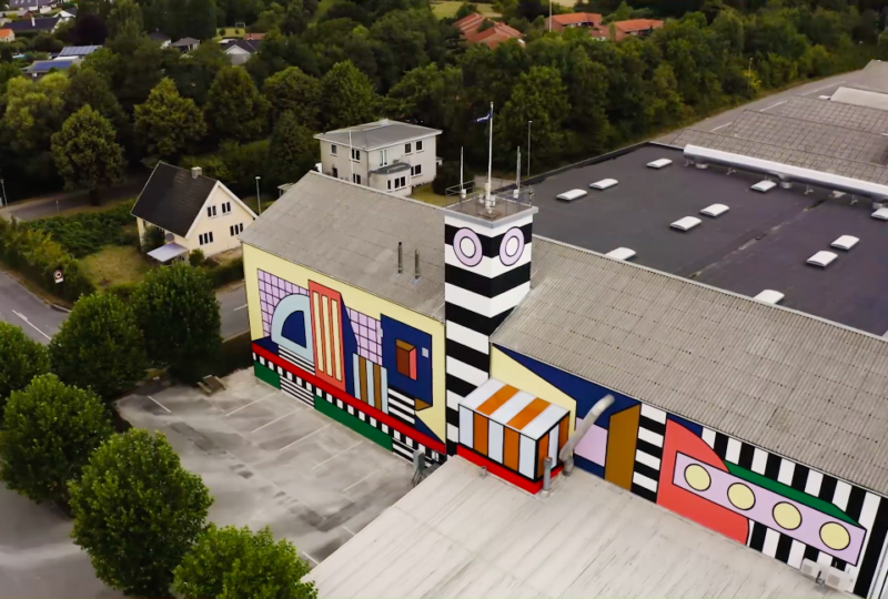 Aerial view of Camille Walala building wrap installation on Montana Furniture factory in Denmark