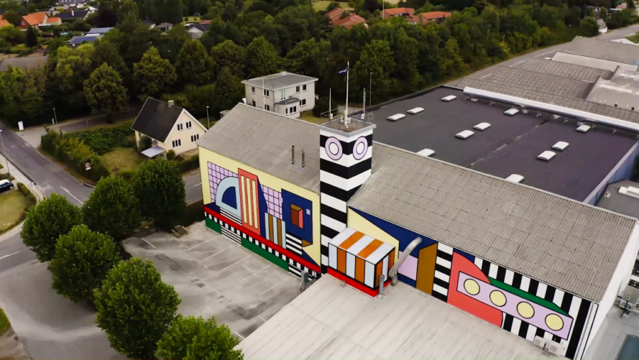 Aerial view of Camille Walala building wrap installation on Montana Furniture factory in Denmark