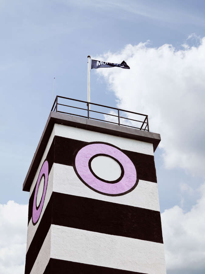 Graphic tower element of Camille Walala building wrap on Montana Furniture factory in Denmark