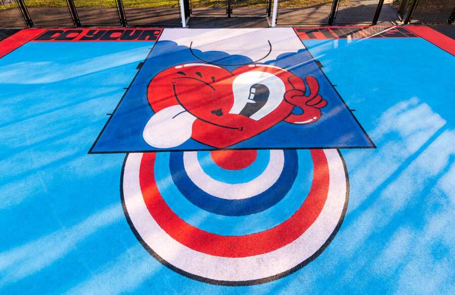 Close detail of Hattie Stewart painted basketball court artwork at Orchard Park Portsmouth