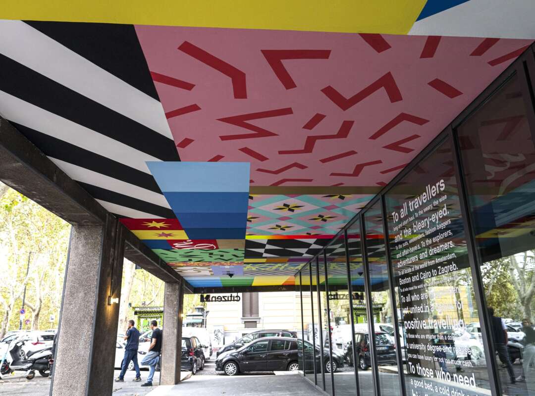 UNO Ceiling Mural Corridor Wide view of painted ceiling mural by UNO spanning the CitizenM Rome entrance corridor