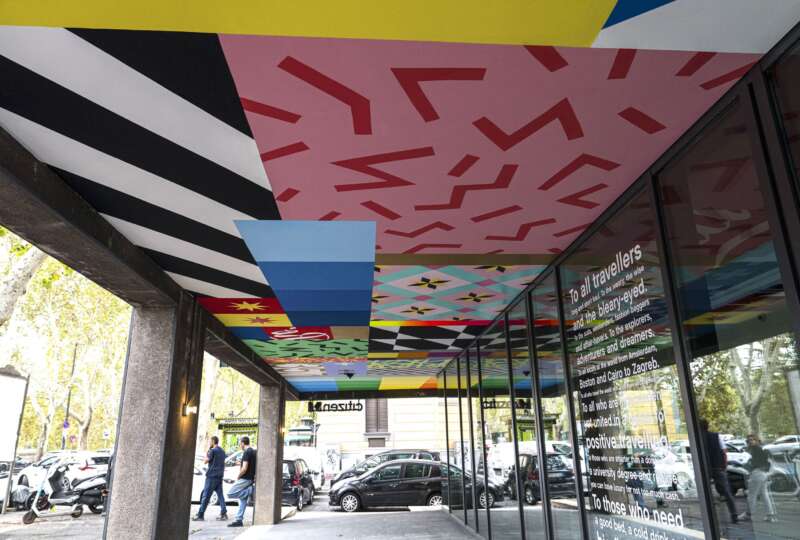 Wide view of painted ceiling mural by UNO spanning the CitizenM Rome entrance corridor