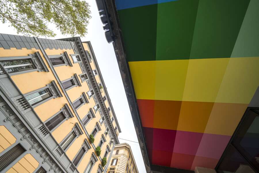 Colourful ceiling mural underside visible from street outside CitizenM Hotel Rome