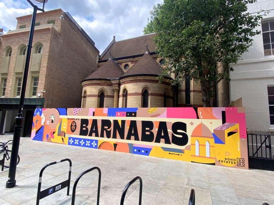 Wide view of House of St Barnabas hoarding mural on Manette Street Soho