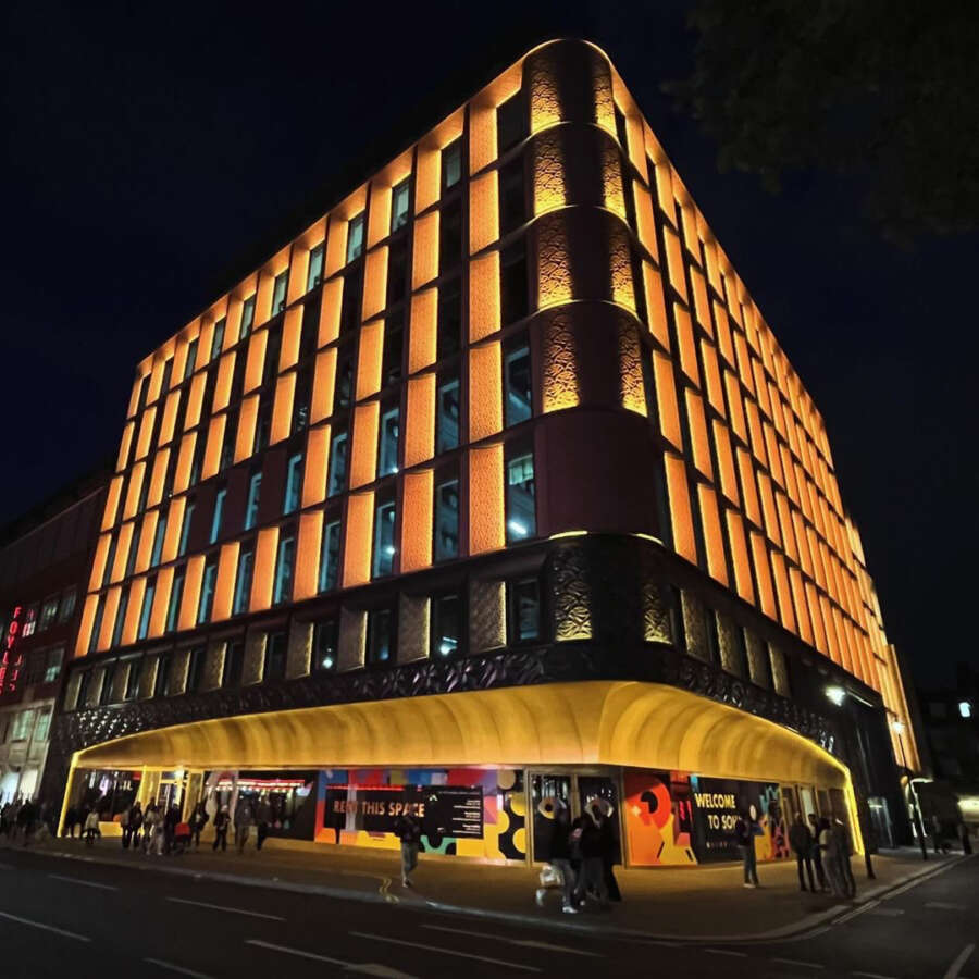 Ilona Rose House building on Manette Street Soho at night with vinyl mural installation