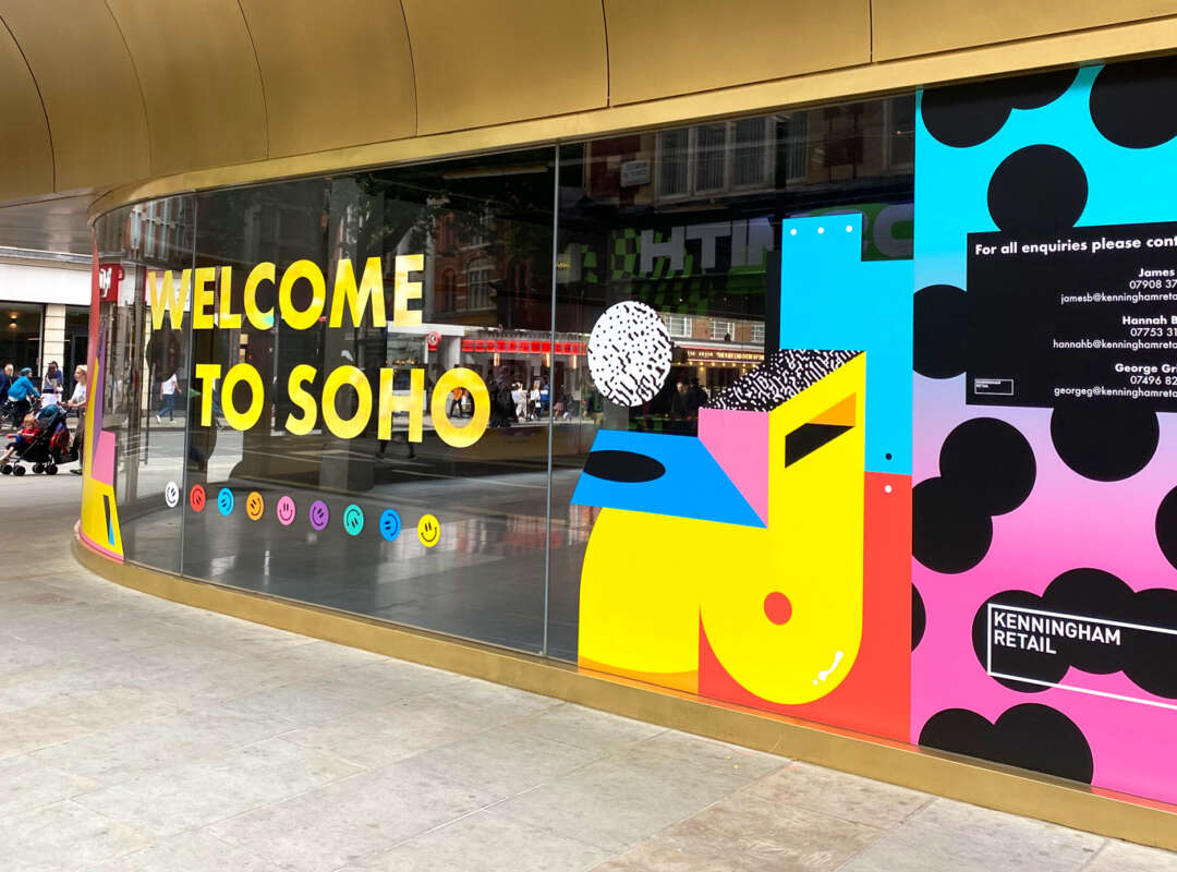 Welcome to Soho mural Colourful vinyl mural by Darren John featuring Welcome to Soho message on development hoarding in central London