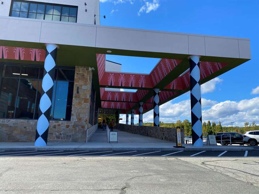 Painted architectural canopy mural installed over building entrance in Boston