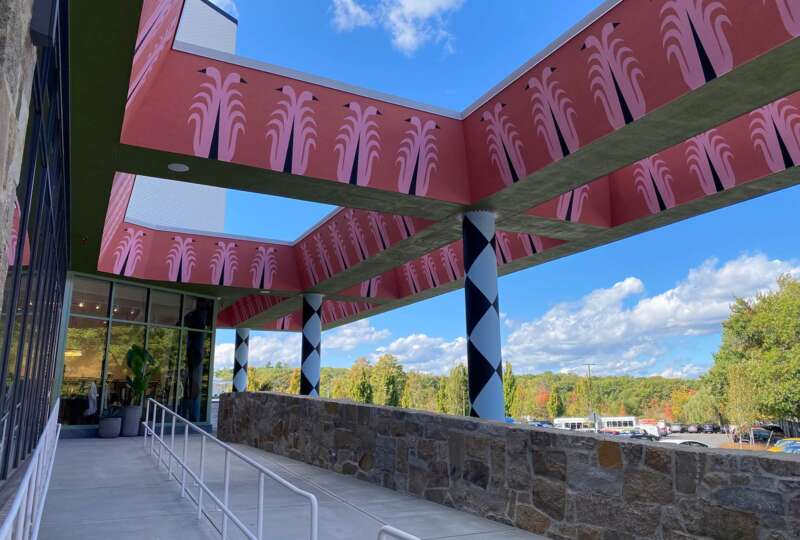 Exterior walkway beneath painted canopy mural installation in Boston
