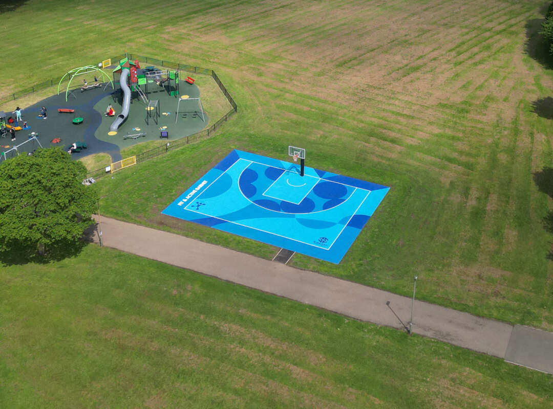Aerial view of painted basketball court mural by Darren John in Barnet park, North London