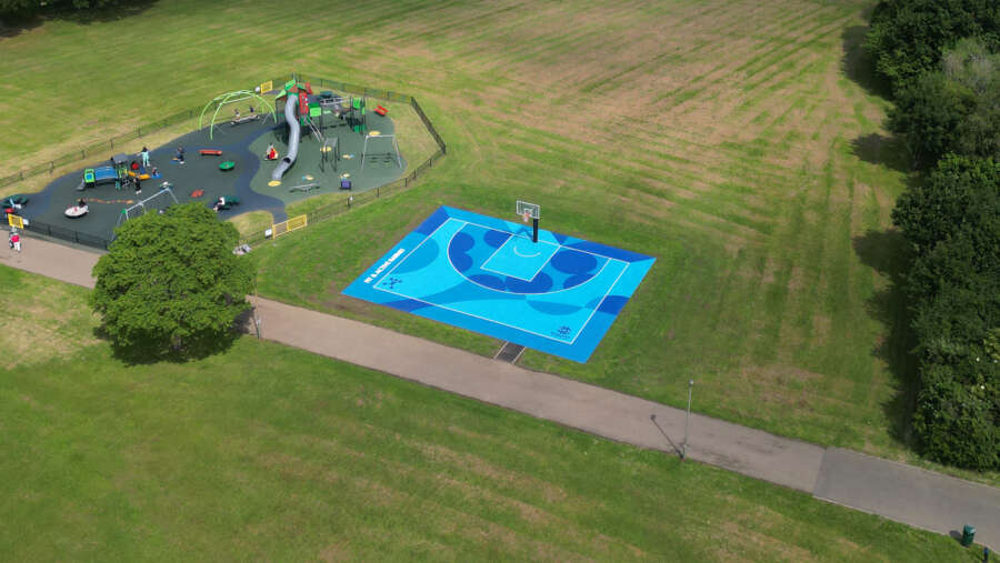 Aerial view of painted basketball court mural by Darren John in Barnet park, North London