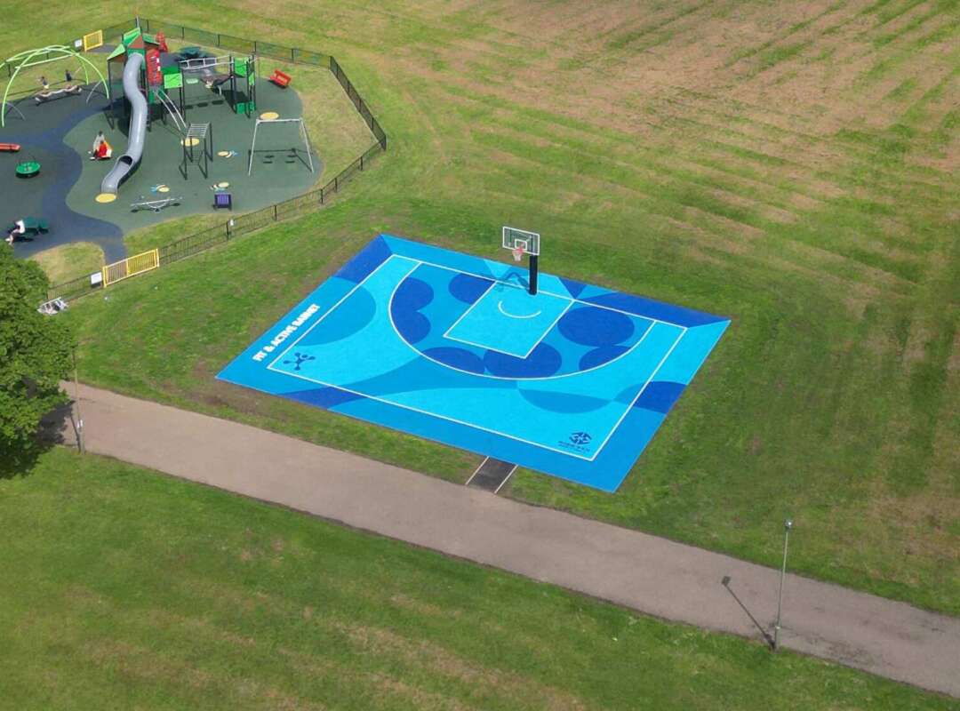Aerial view of painted basketball court mural by Darren John in Barnet park, North London