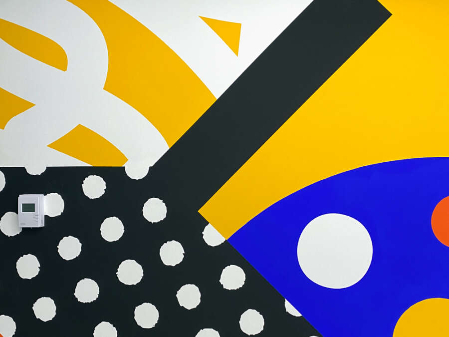 Detail of colourful geometric mural painted by Darren John at the London School of Hygiene & Tropical Medicine