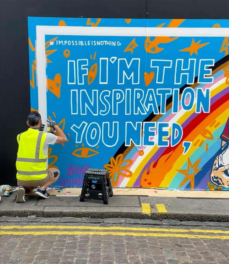 Artist painting Adidas campaign mural celebrating Mapi León for UEFA Women’s EURO 2022