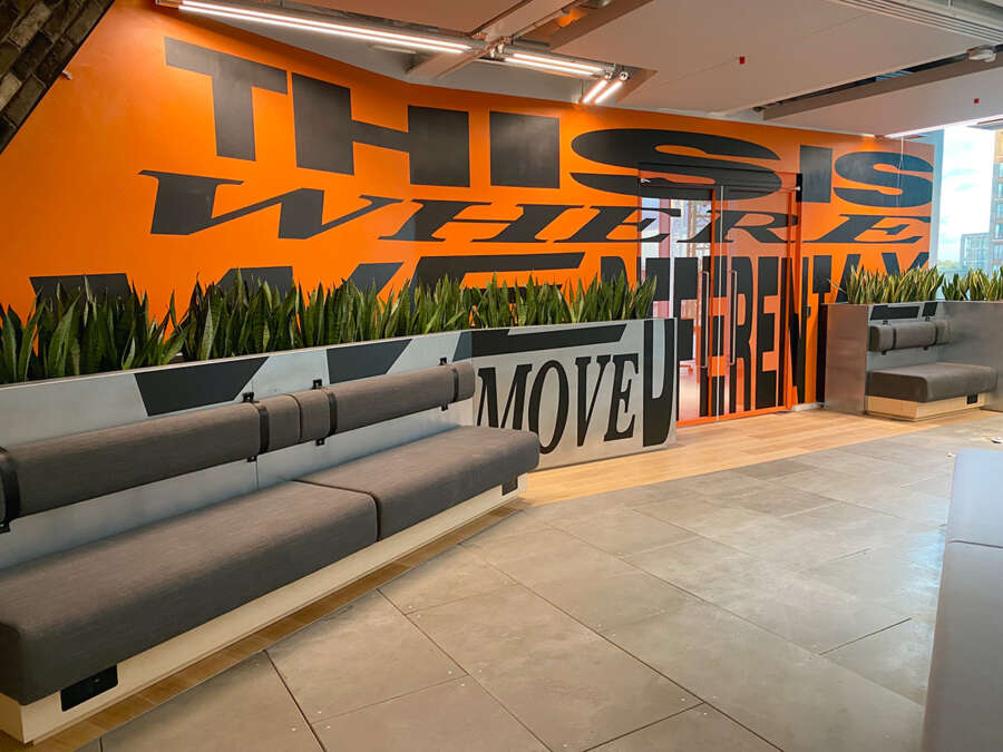 Interior mural installation by Lakwena at Nike headquarters in Kings Cross London