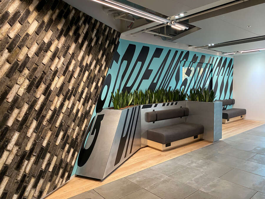 Large typographic mural by Lakwena installed within Nike London headquarters