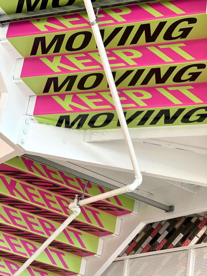 Typographic artwork by Lakwena applied across staircase structure at Nike headquarters