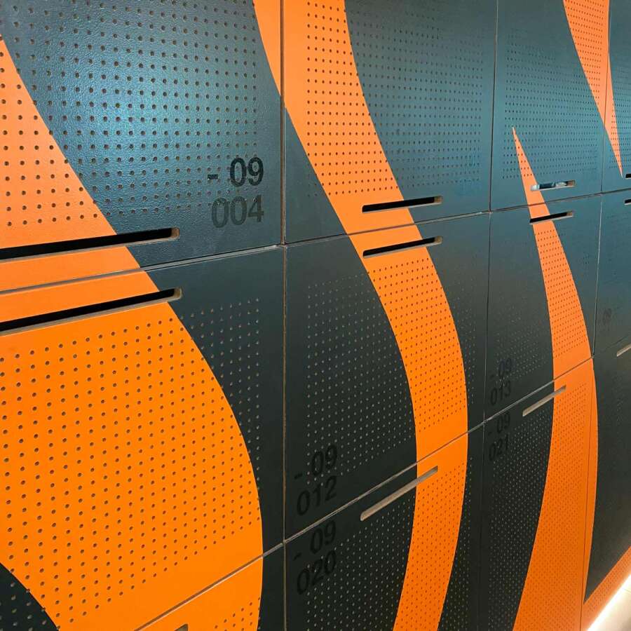 Close detail of painted mural lockers within Nike London headquarters