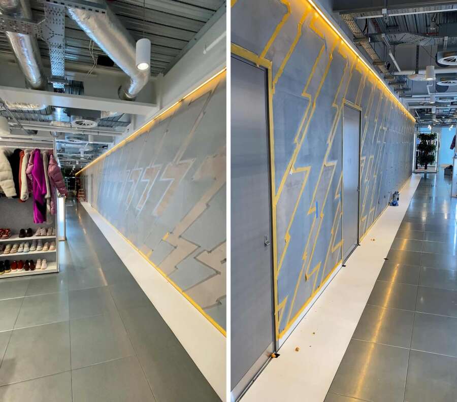 Preparation and masking stage before painting chevron wall graphics on concrete surface